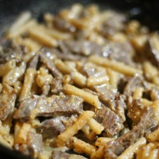 close up shot of alfredo steak in the pan