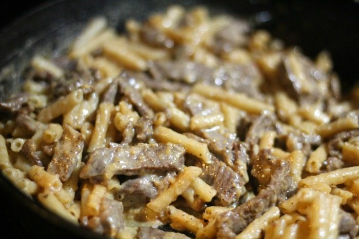 close up shot of alfredo steak in the pan