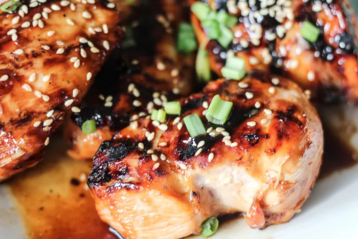 Grilled Teriyaki Chicken topped with green onions and sesame seeds