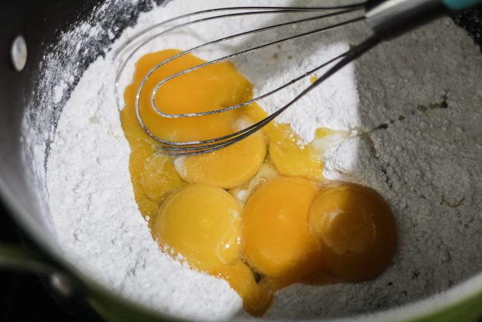 eggs and flour being mixed together