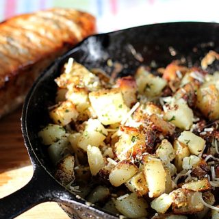 This recipe for garlic and herb pork loin with Parmesan Fried Potatoes is THE perfect recipe for your summer grilling