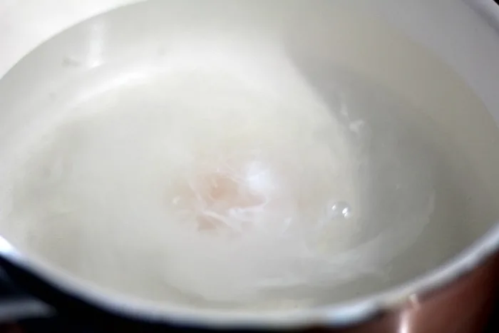 perfectly poached egg in water