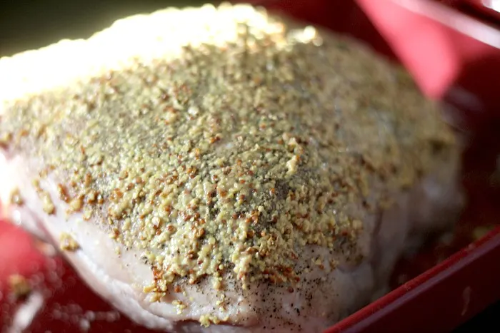 pork loin topped with mustard and brown sugar