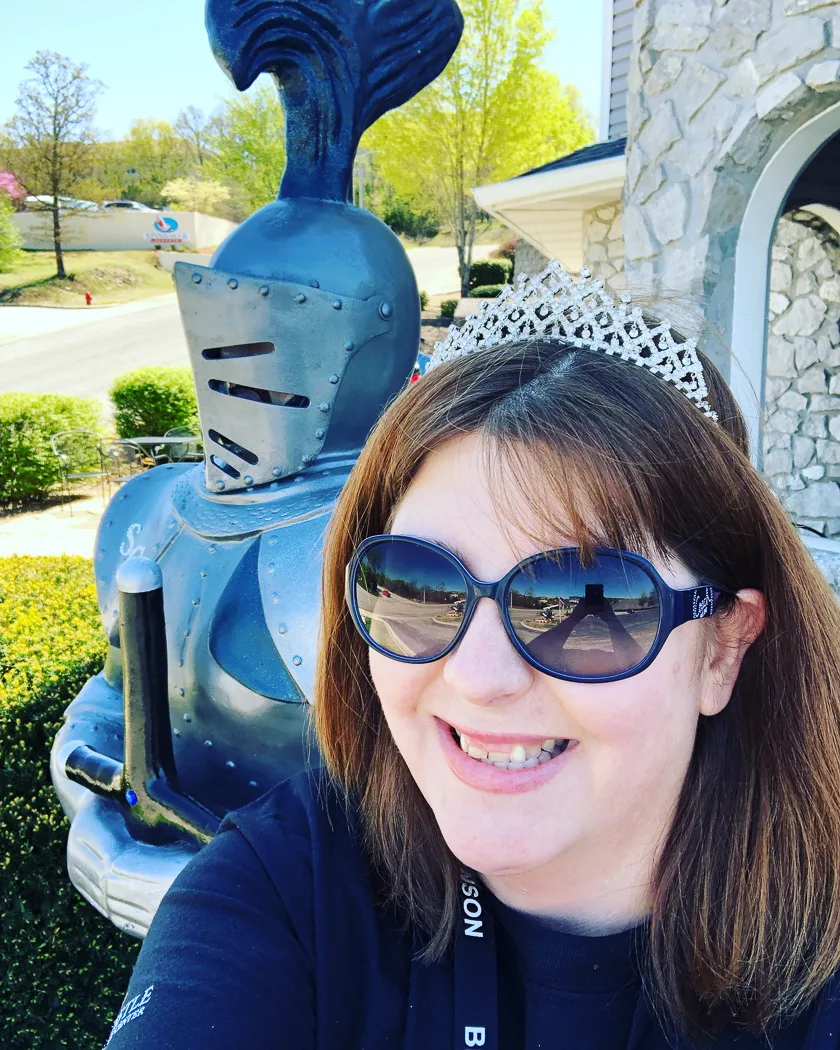 Jennifer out front of hotel with statue