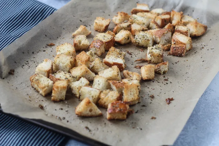 easy homemade croutons on baking sheet with parchment paper