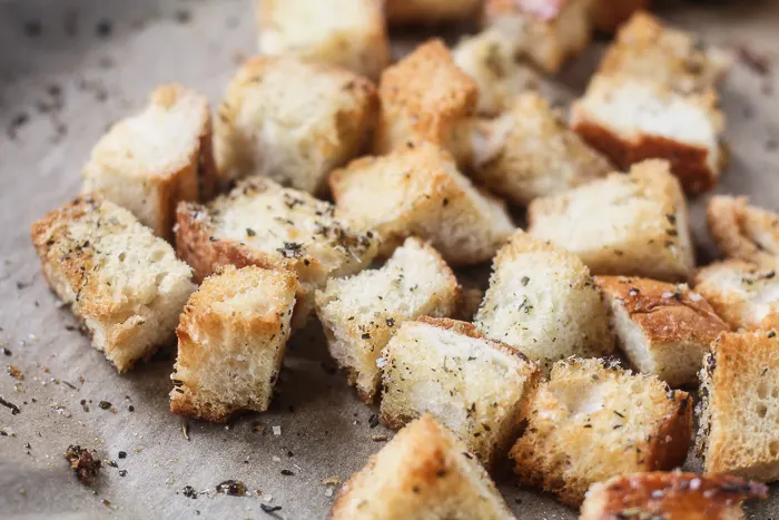 Croutons up close on parchment paper