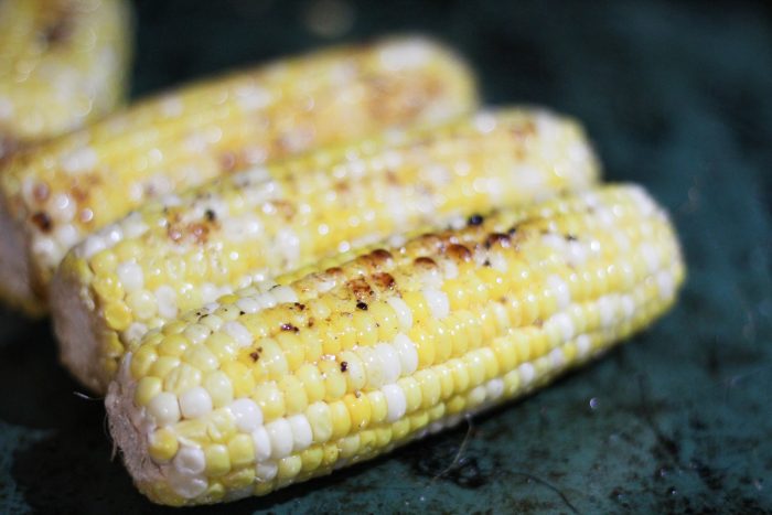 oven roasted corn on the cob up close long image
